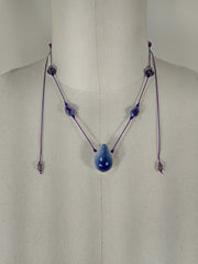 Drop, purple silk string, glass beads